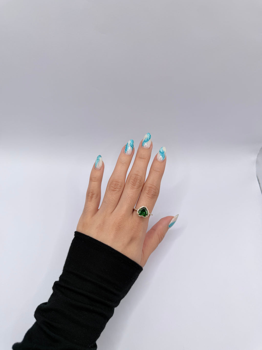 Emerald-colored heart-shaped stone ring